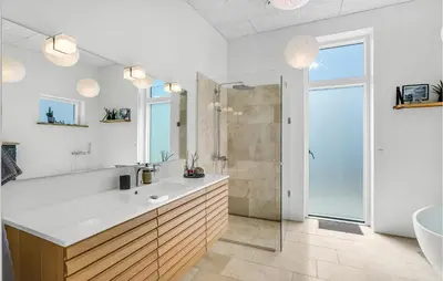 a bathroom with a sink and a glass shower at Lovely Home In Thisted With Wifi in Thisted