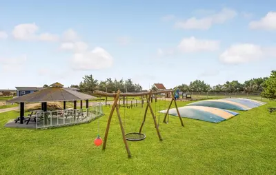 a park with a playground with a swing set at Gorgeous Home In Vestervig With Kitchen in Vestervig