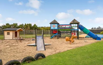 a playground with a slide and a play structure at Lovely Home In Vestervig With Kitchen in Vestervig