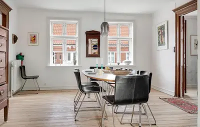 a dining room with a table and black chairs at Stunning Home In Vestervig With Wifi in Vestervig