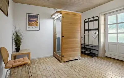 a room with a walk in closet and a door at 2 Bedroom Gorgeous Apartment In Pandrup in Pandrup