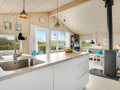 a kitchen with a sink and a counter top at Holiday Home Syni - 500m from the sea by Interhome in Pandrup