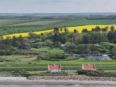 an aerial view of a farm with yellow fields at Holiday Home Aranja - 300m to the fjord by Interhome in Løgstør