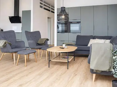 a living room with a couch and chairs and a table at 12 person holiday home in Lemvig-By Traum in Lemvig