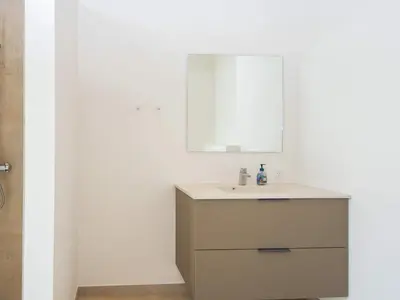 a bathroom with a sink and a mirror at 12 person holiday home in Lemvig-By Traum in Lemvig