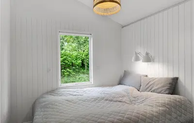 a bedroom with a bed and a window at Awesome Home In Spøttrup With Wifi in Spottrup