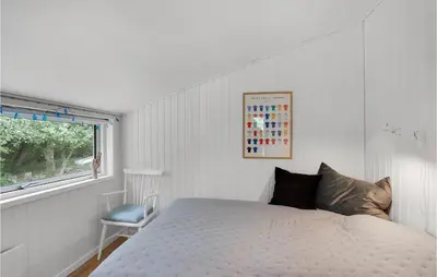 a white bedroom with a bed and a window at Awesome Home In Spøttrup With Wifi in Spottrup