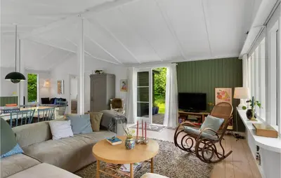 a living room with a couch and a table at Awesome Home In Spøttrup With Wifi in Spottrup